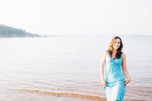 Debs Thorpe walking barefoot on a beach
